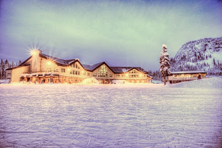 View of the bustling Hoodoo Ski Area in Sisters, Oregon, showcasing a vibrant winter sports scene amid the stunning winter scenery of the resort.