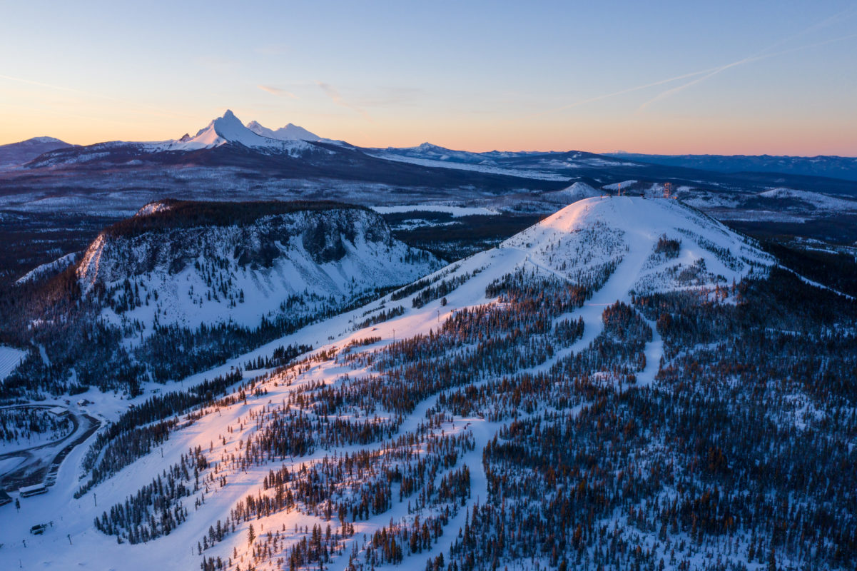 Hoodoo Ski Area in USA - the sun is setting on a snowy mountain.