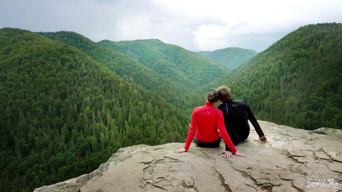 Praděd | ​Myšák – Malá Morávka in Czech Republic - two people sitting on top of a mountain.