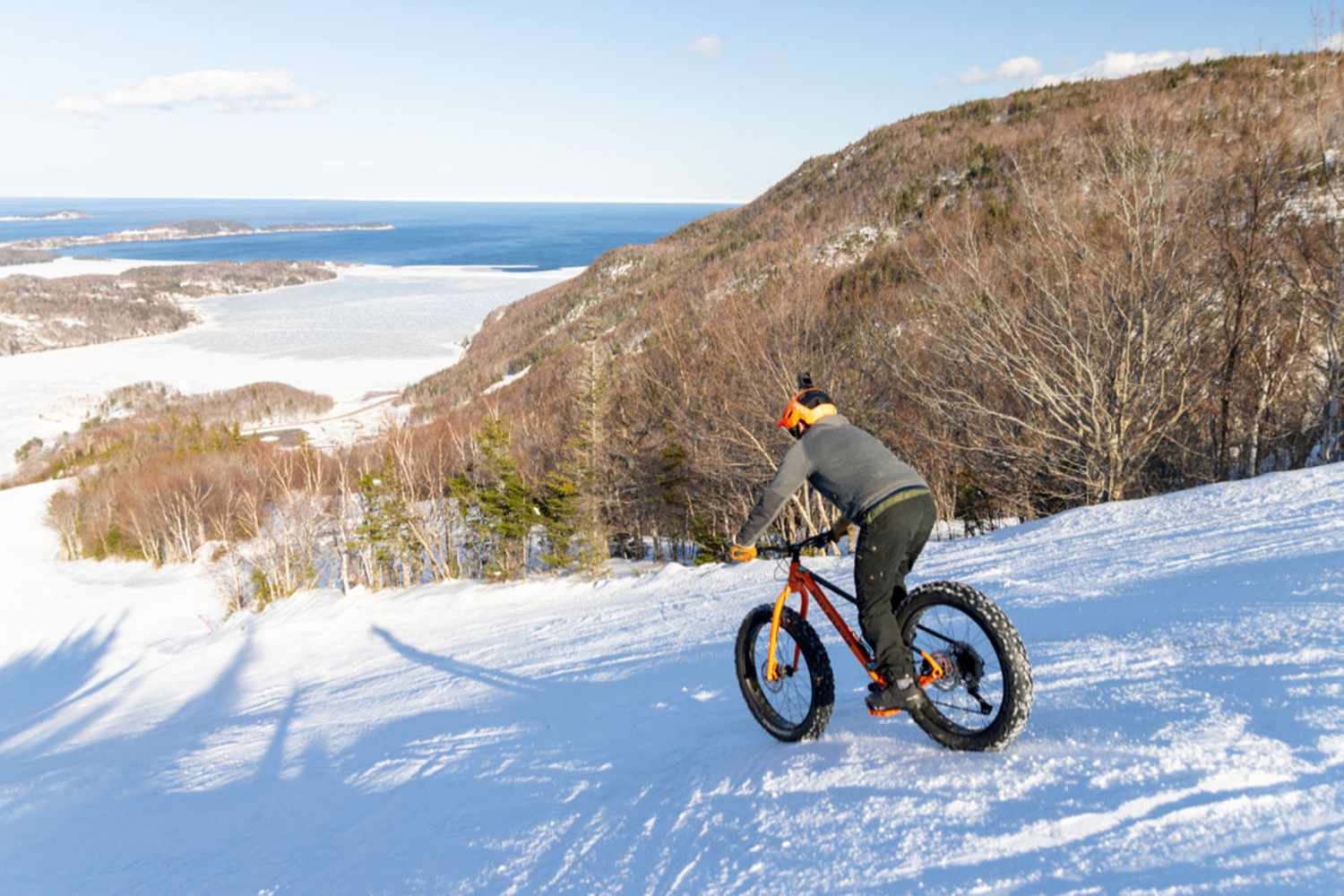 Ski Cape Smokey in Canada - a man riding a snow bike on a snowy slope.