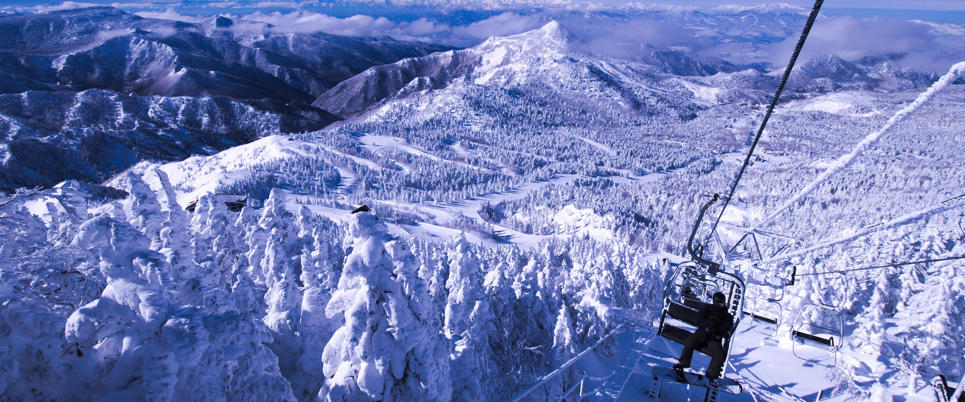 Yokoteyama-Shibutoge in Japan - a ski lift going up a snowy mountain.