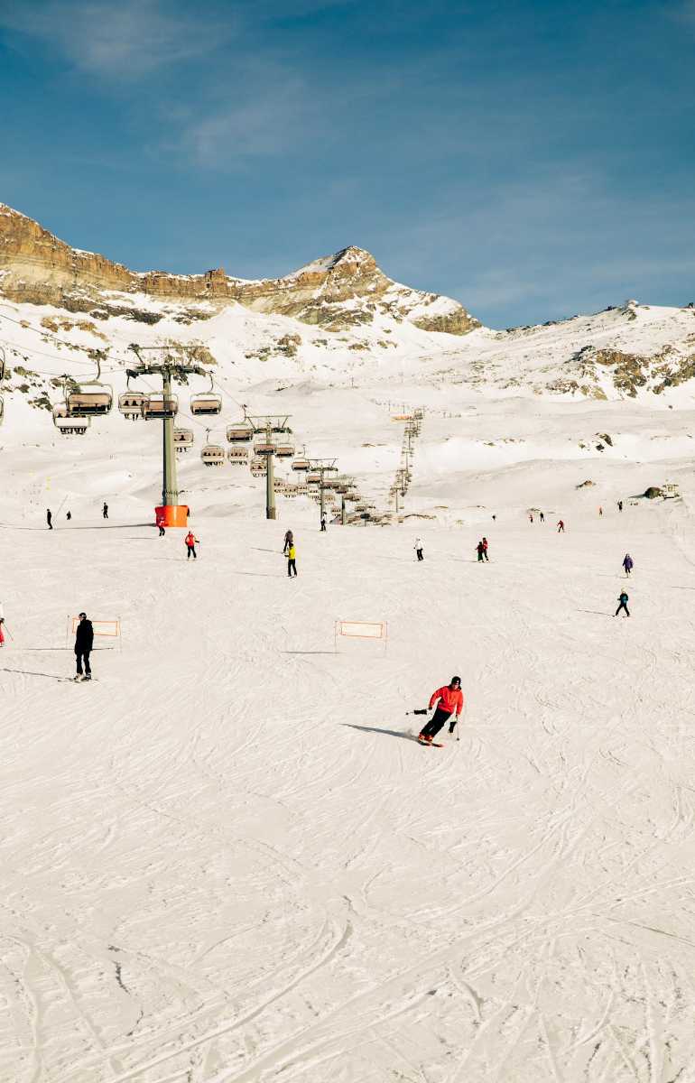 Klausberg – Skiworld Ahrntal in Italy - a group of people skiing down a snowy slope.