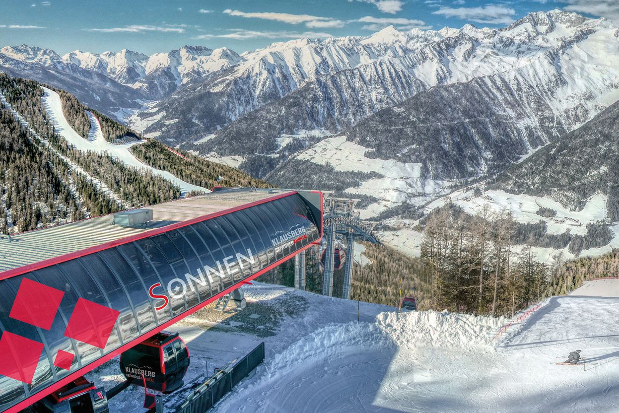 Klausberg – Skiworld Ahrntal in Italy - a ski lift going up a snowy mountain.