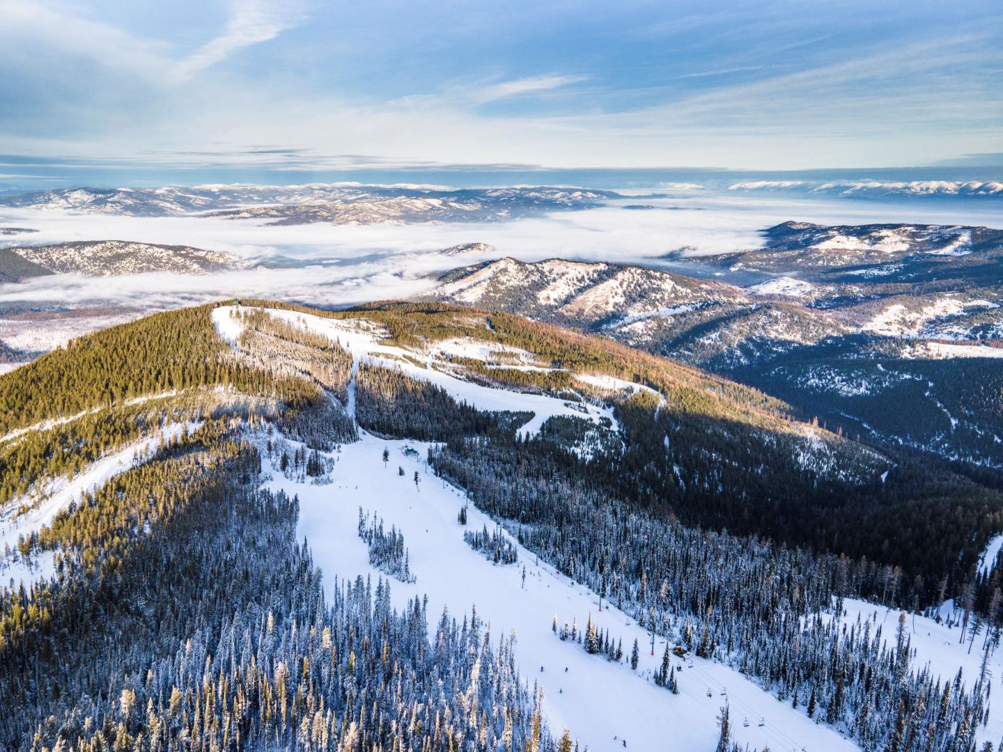 Blacktail Mountain in USA - a view from the top of a snowy mountain.