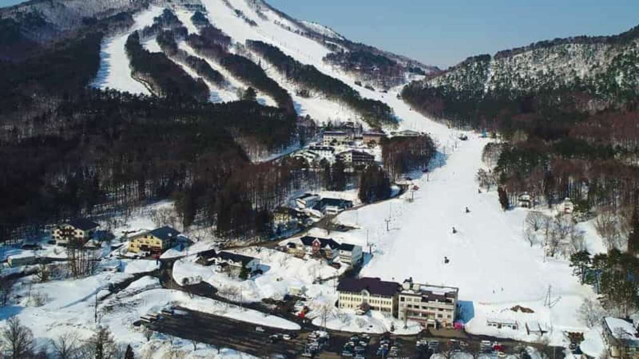 X-JAM Takaifuji in Japan: an aerial view of a ski resort in the mountains.