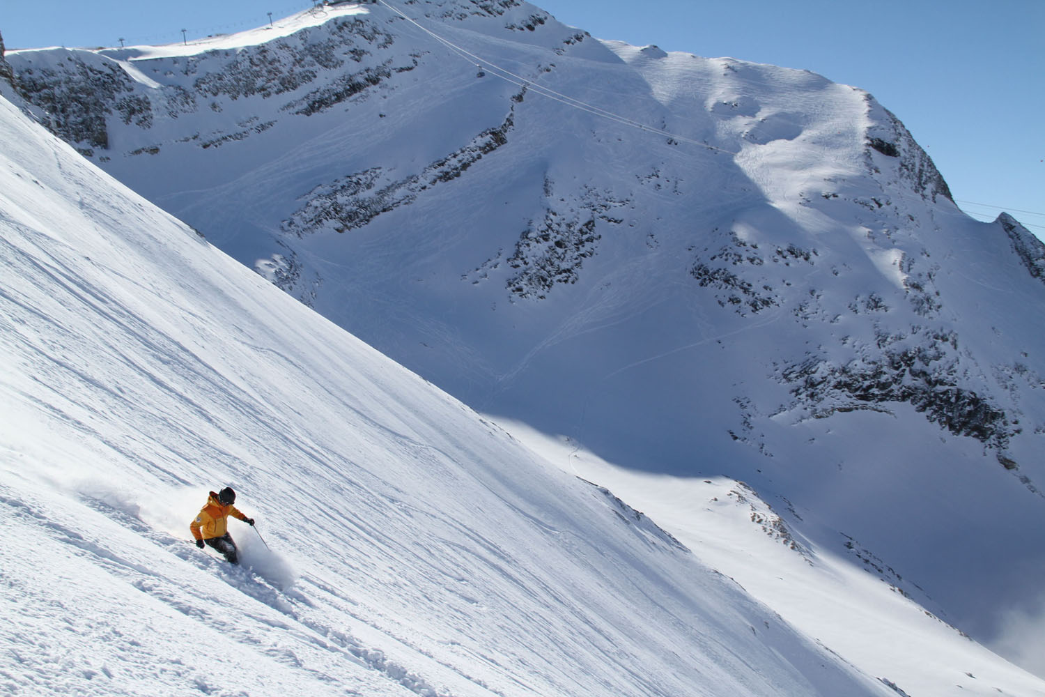 Bivio in Switzerland - a person skiing down a snowy mountain.