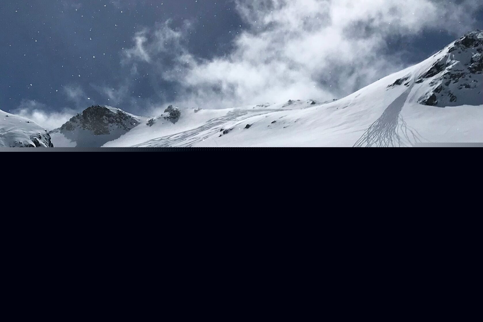 Bivio in Switzerland - a person skiing down a snow covered mountain.