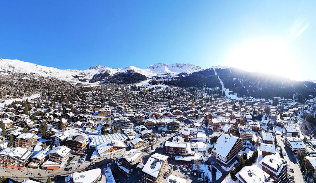 4 Vallees | Verbier in Switzerland - a city with snow covered mountains in the background.