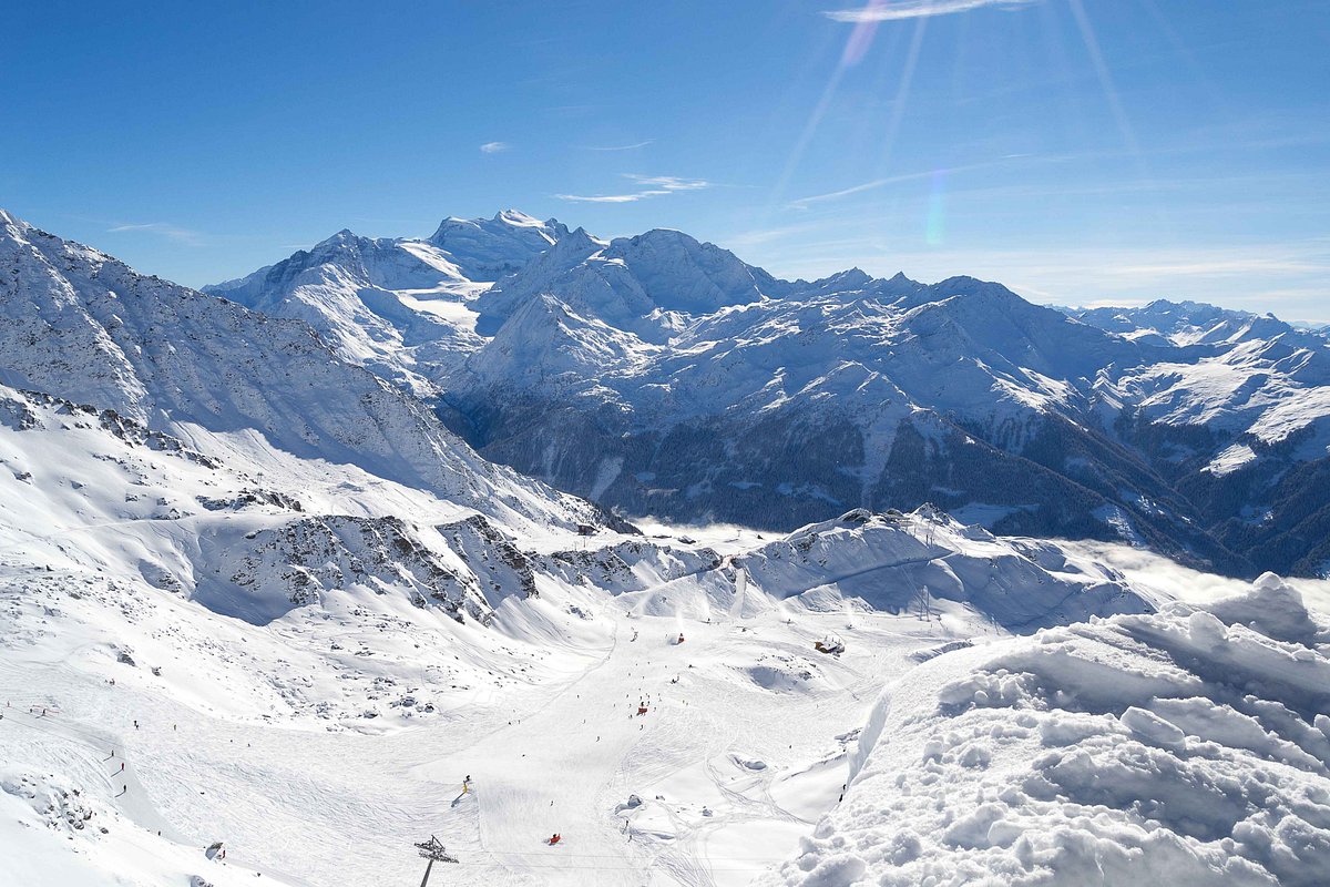 4 Vallees | Verbier in Switzerland - a view from the top of a snowy mountain.