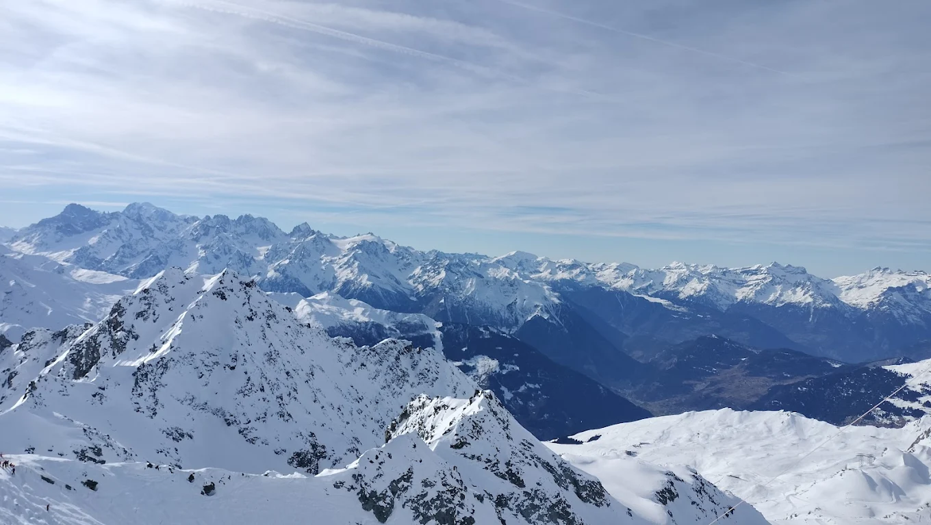 4 Vallees | Verbier in Switzerland - a ski lift going up a snowy mountain.