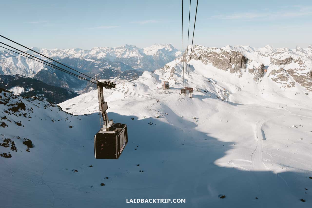 4 Vallees | Verbier in Switzerland - a ski lift going up a snowy mountain.
