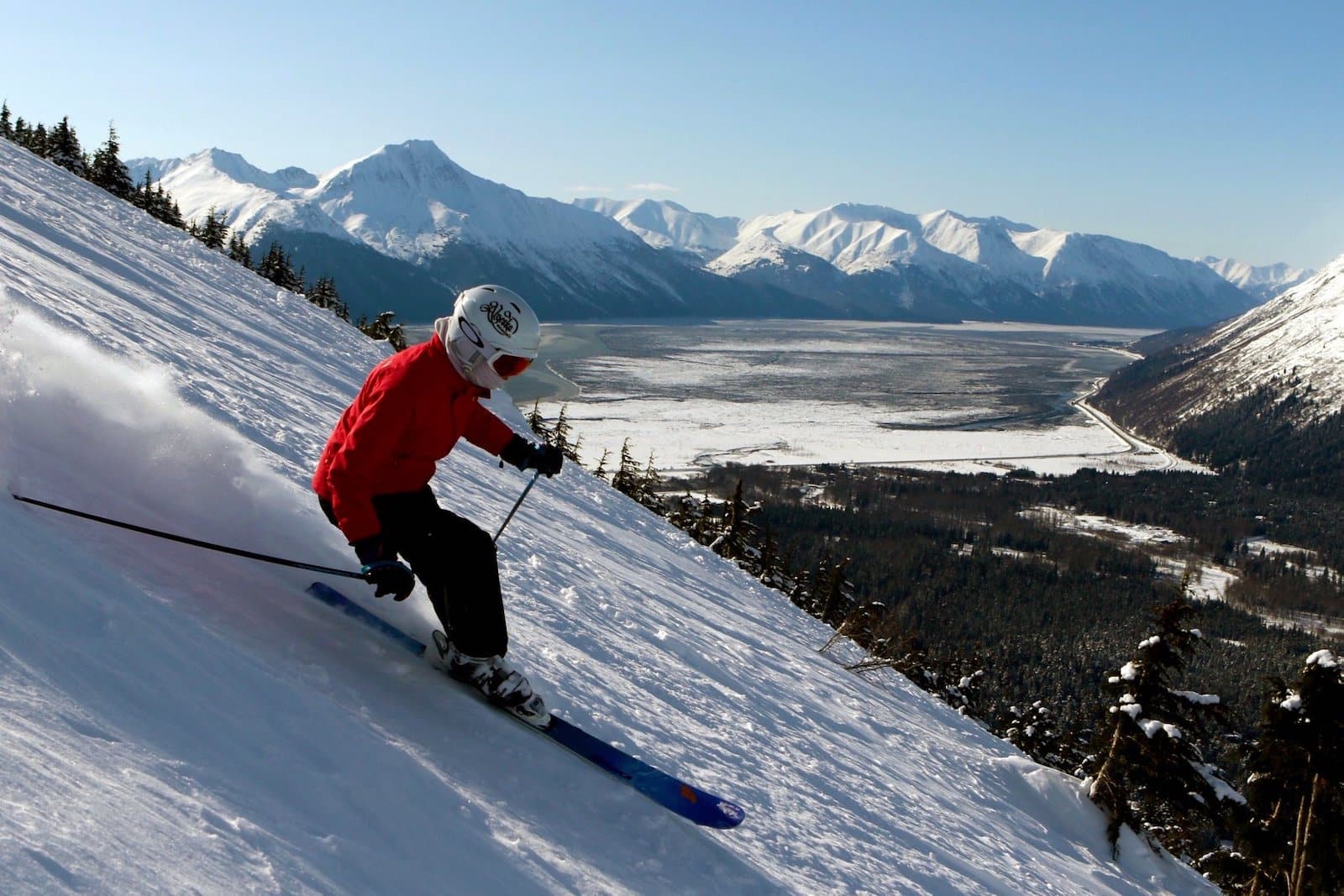 Ski Land Mt Aurora in USA - a person is skiing down a snowy hill.