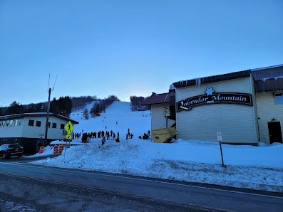 A winter sports centre and ski resort at Labrador Mountain in Truxton New York boosting a lively winter sports scene with a ski lift and a charming chalet.