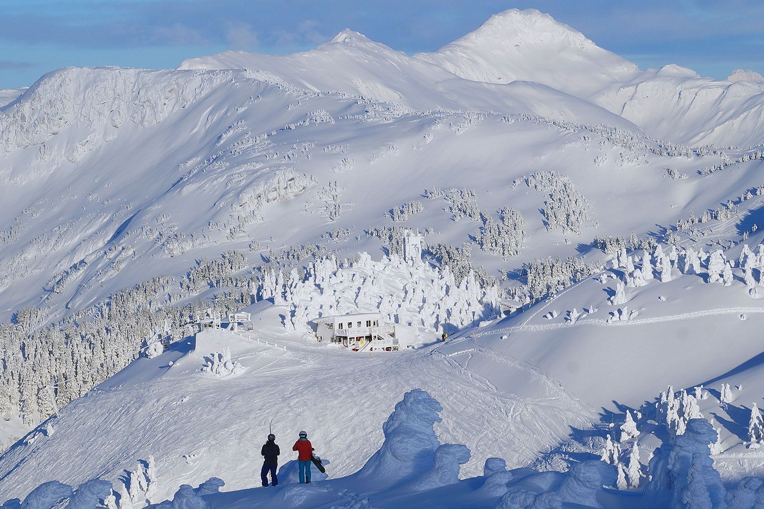 Eaglecrest in USA - a person standing on top of a snowy mountain.
