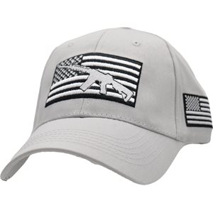 A picturesque view at Eaglecrest in Juneau Alaska shows a cozy challet nestled at the base of a stunning mountain. A skier glides effortlessly through the fresh snow while the lodge and a snowmobile are slightly visible in the background.