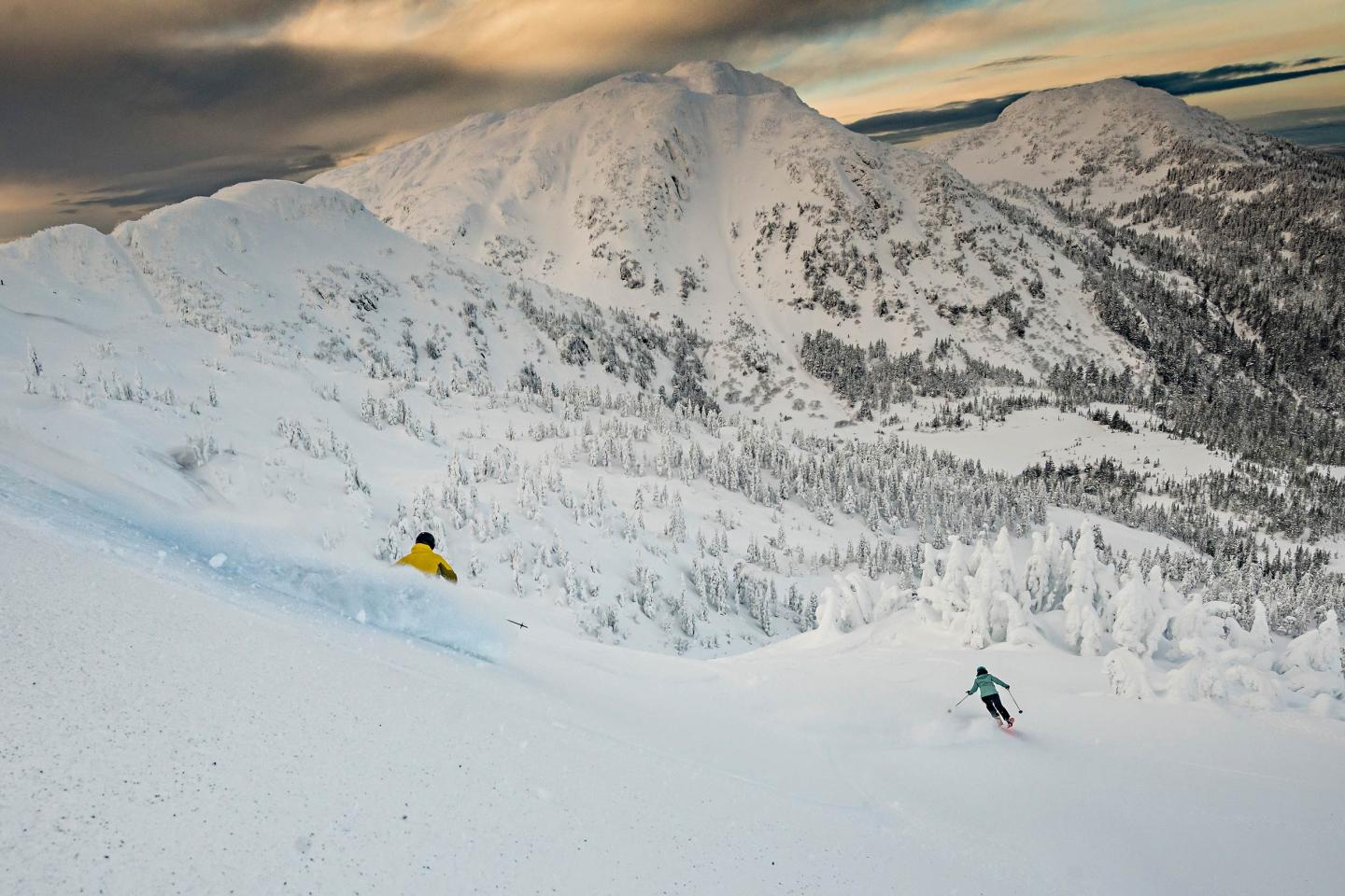 Eaglecrest in USA - a person skiing down a snow covered mountain.