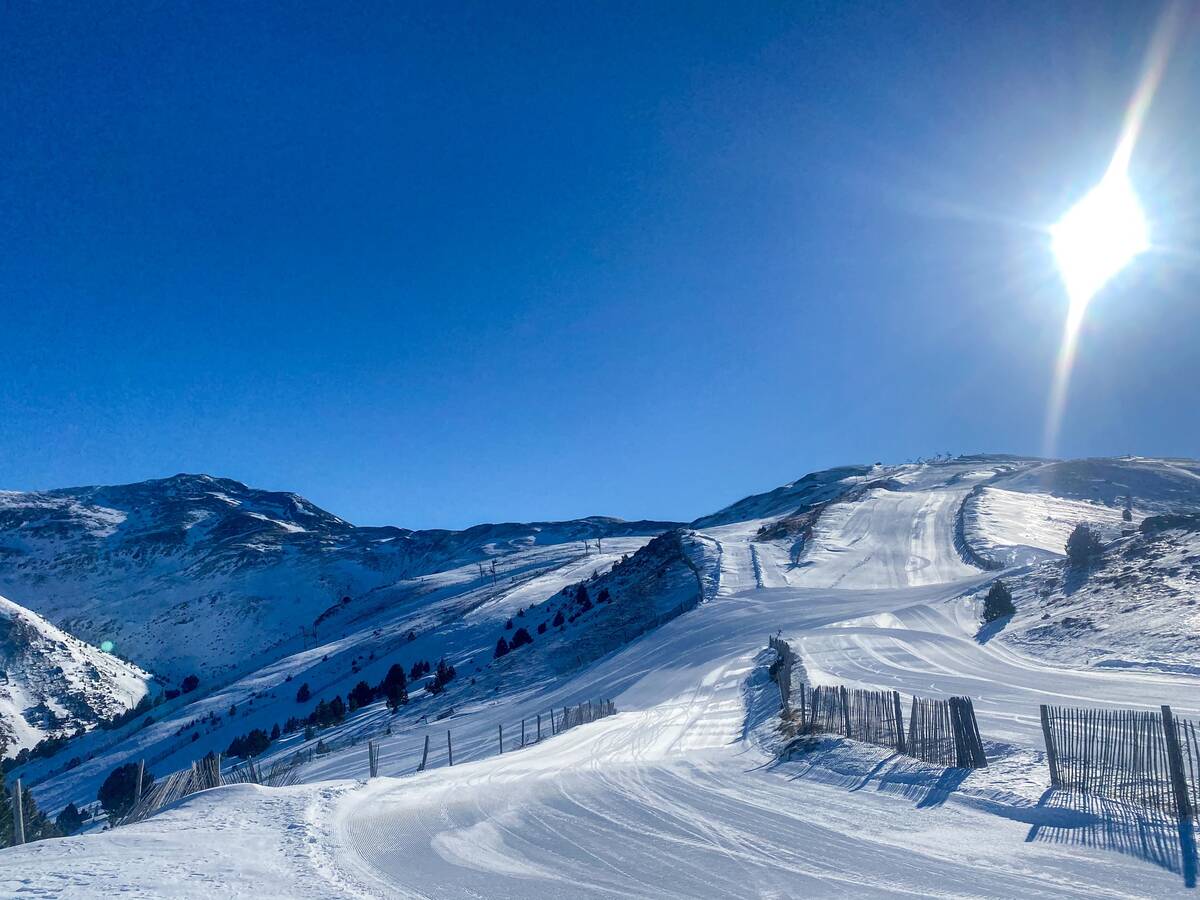 Puigmal in France - the sun is shining over the snow covered mountains.