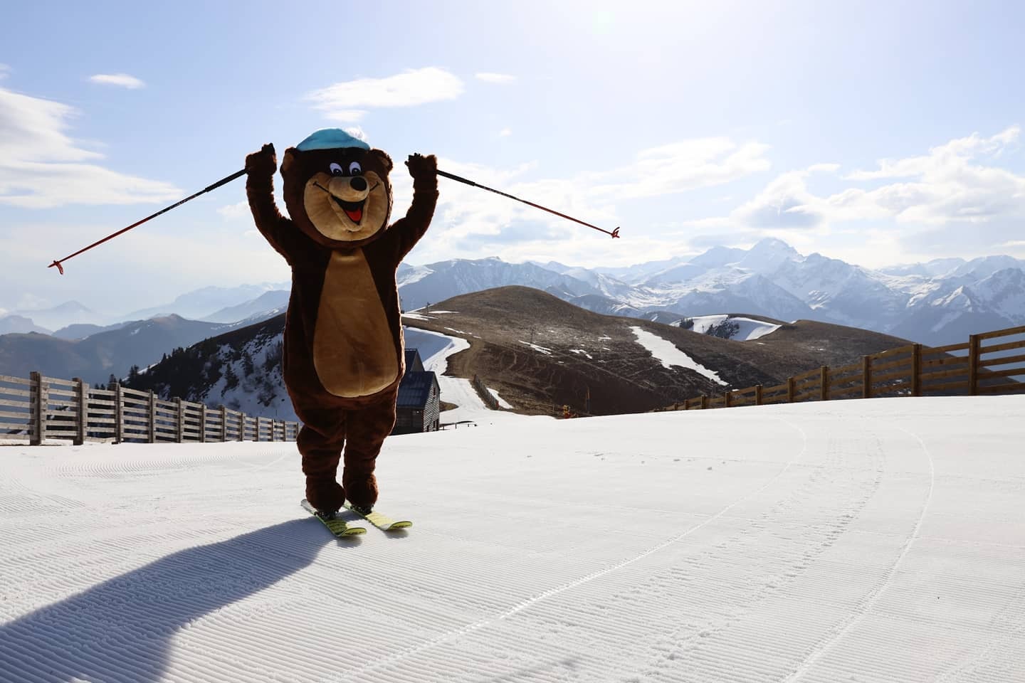 Mourtis in France - a person dressed as a bear on a ski slope.