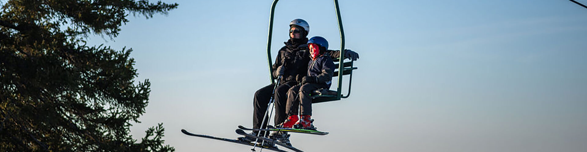 Giants Ridge in USA - a man riding a ski lift in the air.