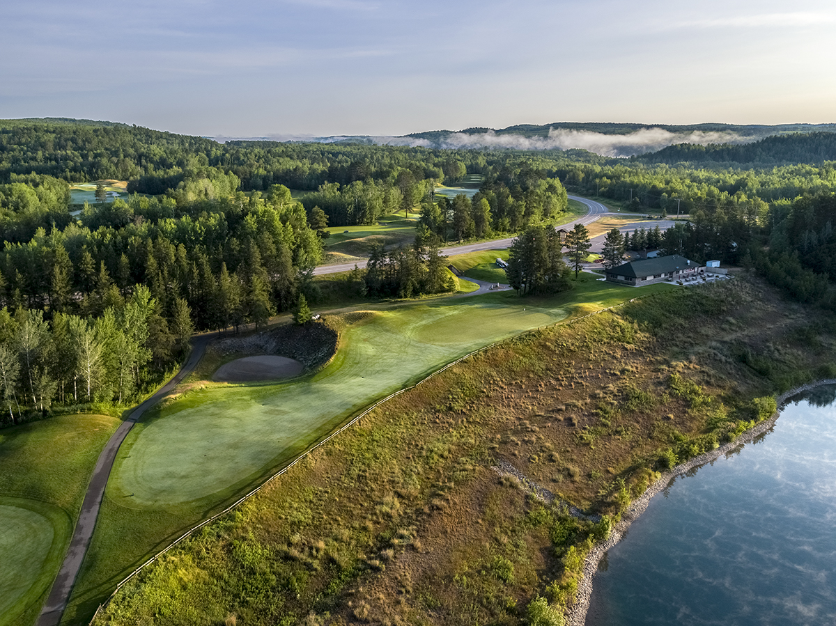 Giants Ridge in USA - an aerial view of a golf course surrounded by trees.