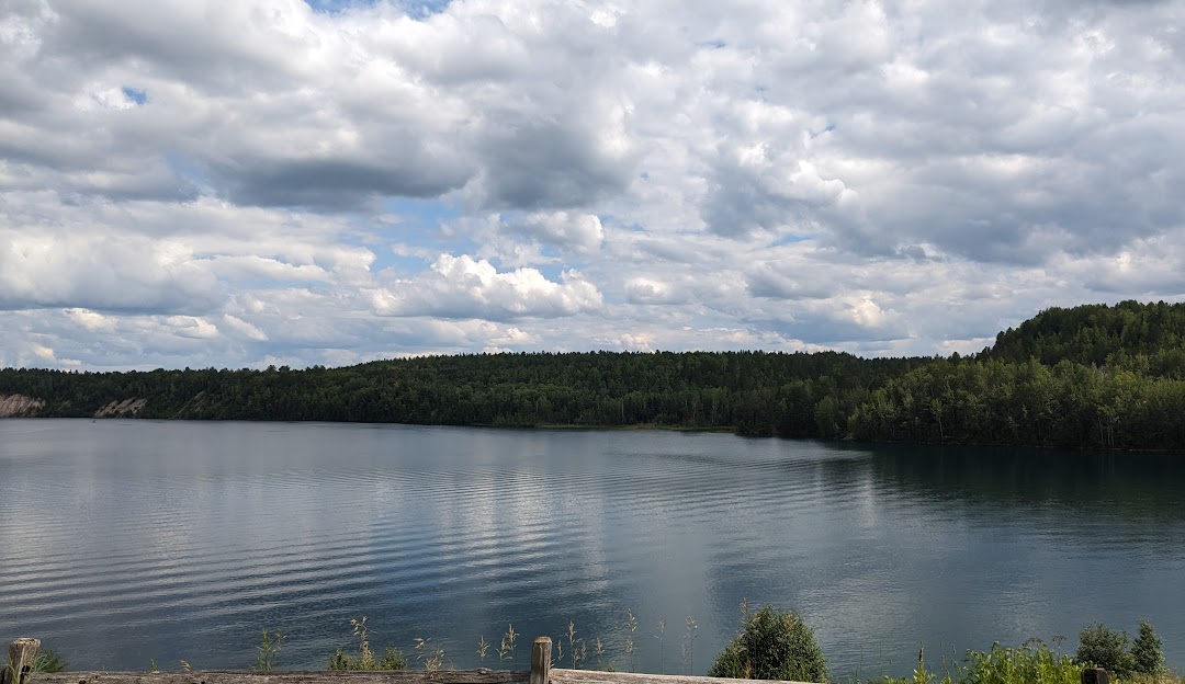Scenic view of a sparkling lake with a charming chalet nestled on its shore in Giants Ridge Biwabik Minnesota.