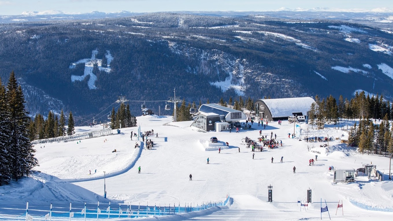 Hafjell in Norway - a ski slope with many skiers on it.