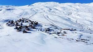 Charming chalet amidst a stunning winter scene at Chapa Verde ski resort, Rancagua, O'Higgins Region, Chile, depicting a classic winter sports ambiance.