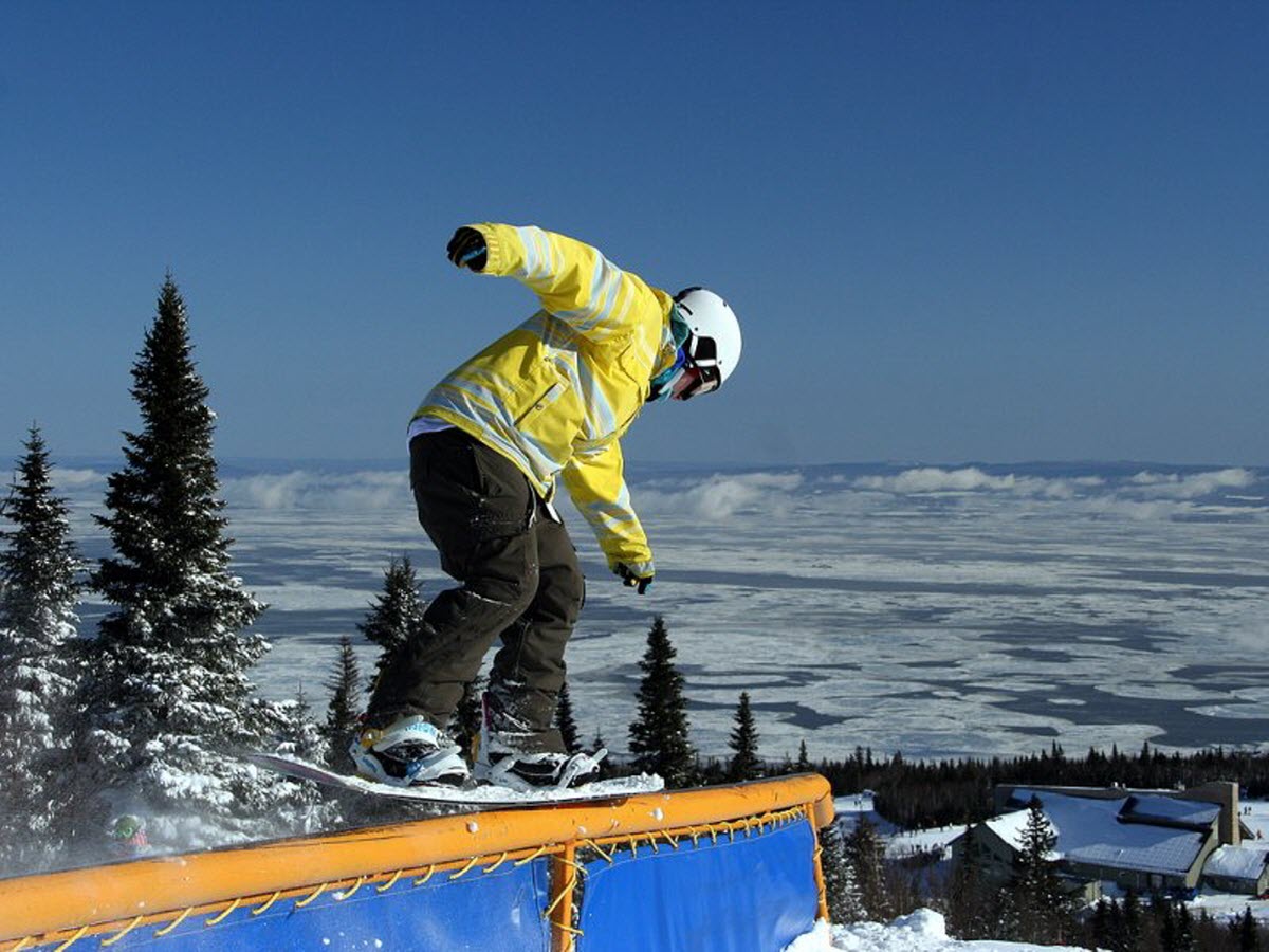 Mont Béchervaise in Canada - a person on a snowboard doing a trick.