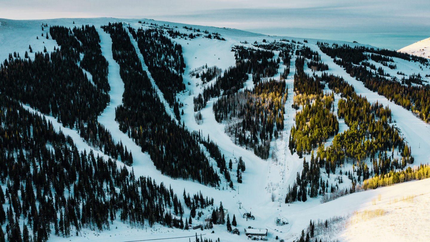 Pomerelle in USA - a person riding a snowboard down a snowy slope.