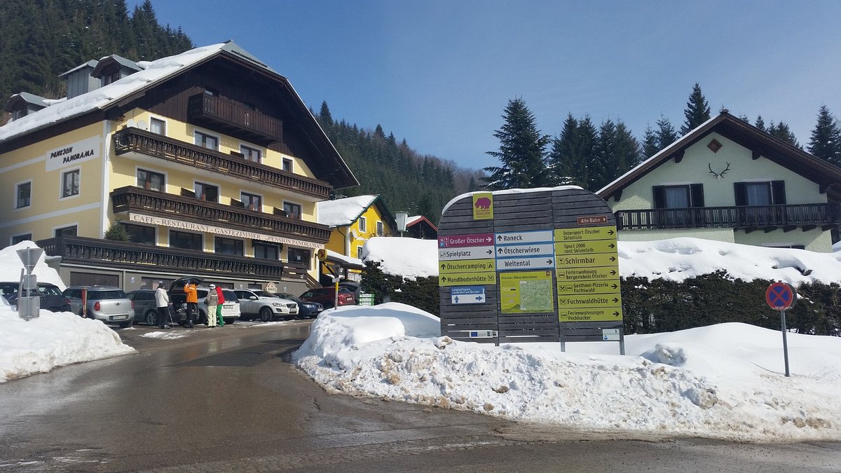 Ötscher – Lackenhof in Austria: a snow covered street in front of a building.