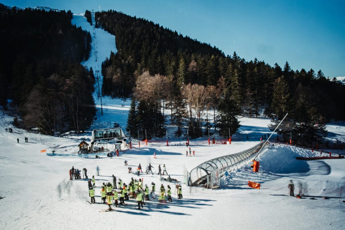 Ascou Pailhères in France - a group of people standing on a snow covered slope.