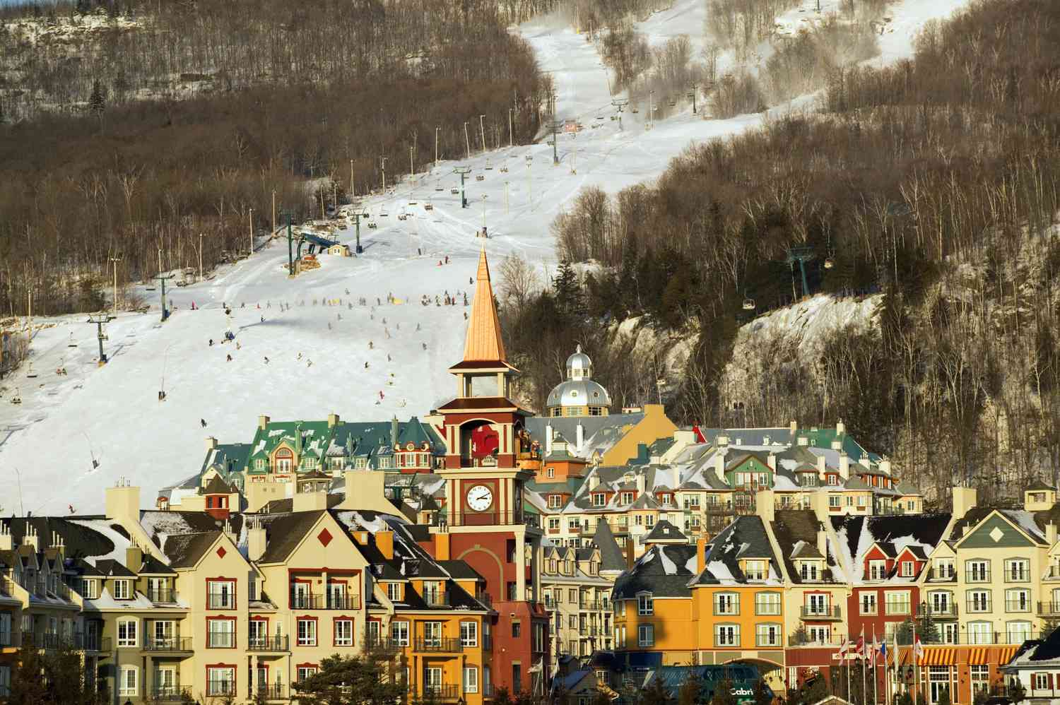 Mont-Tremblant in Canada - a view of a town with a ski slope in the background.