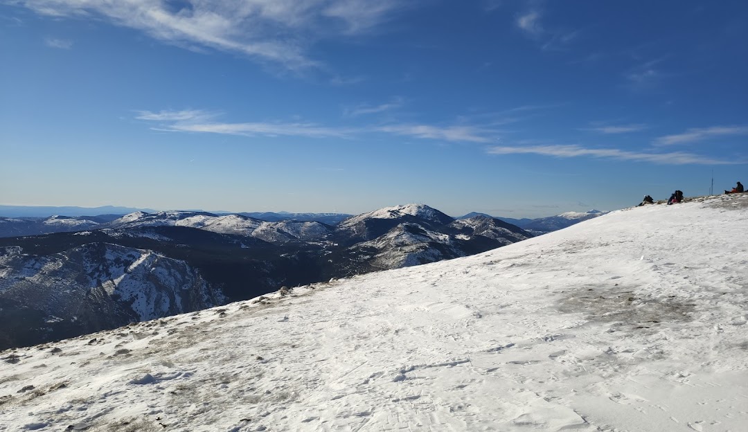 Charming chalet nestled in the snowy slopes of L'Audibergue - La Moulière in Alpes-Maritimes, France. The stunning winter scenery features majestic mountains and active winter sports scene.