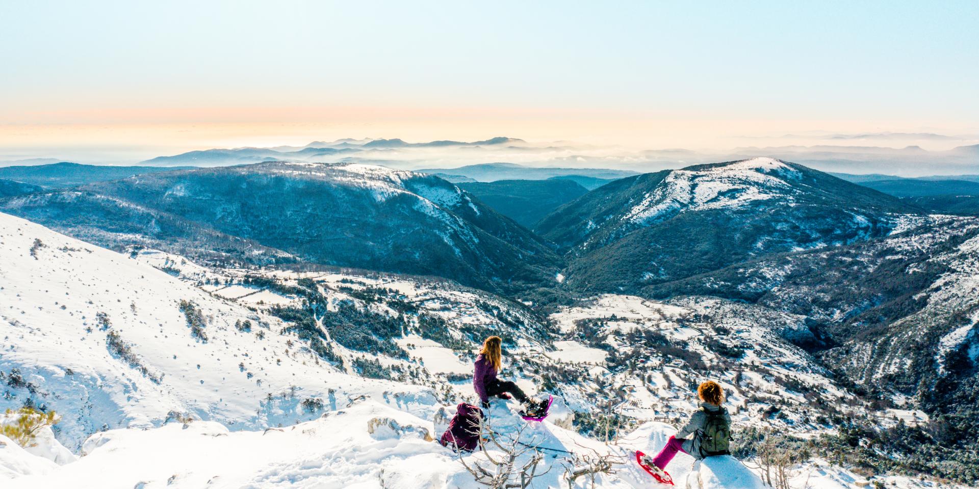 L'Audibergue - La Moulière in France - two people on top of a snowy mountain.