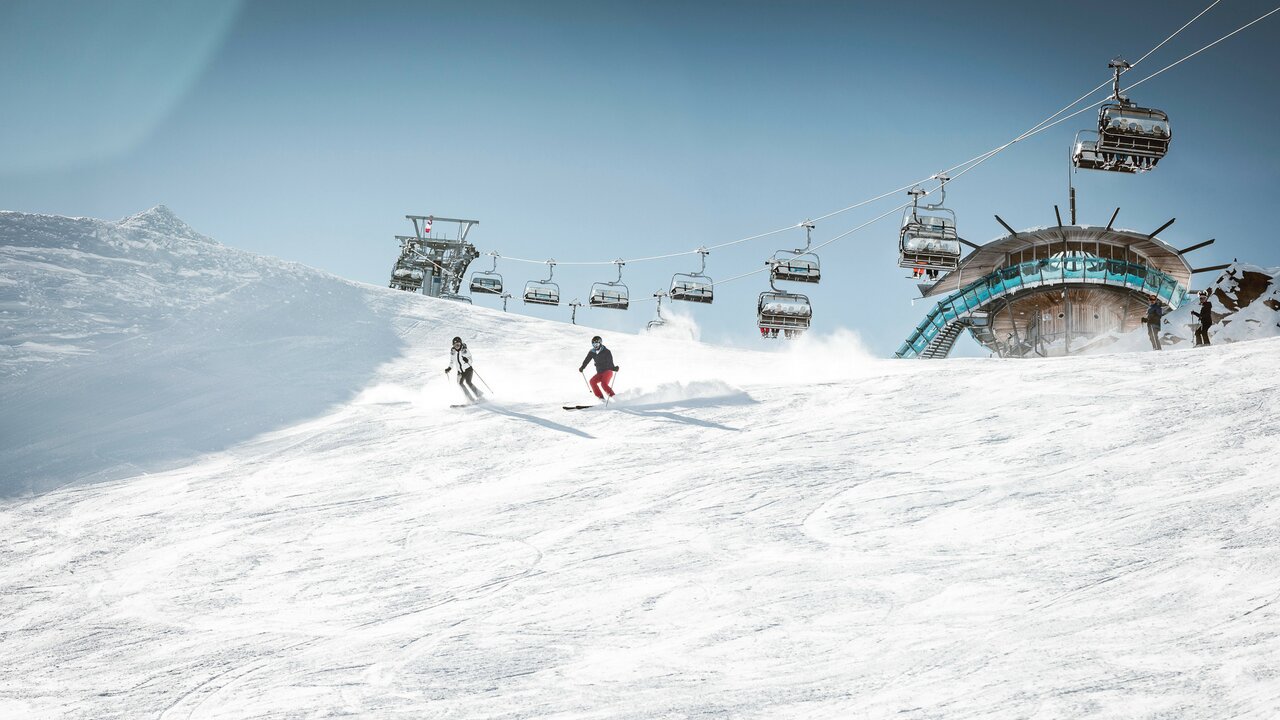 Schattwald - Zöblen in Austria - a person skiing down a snowy slope on ski equipment.