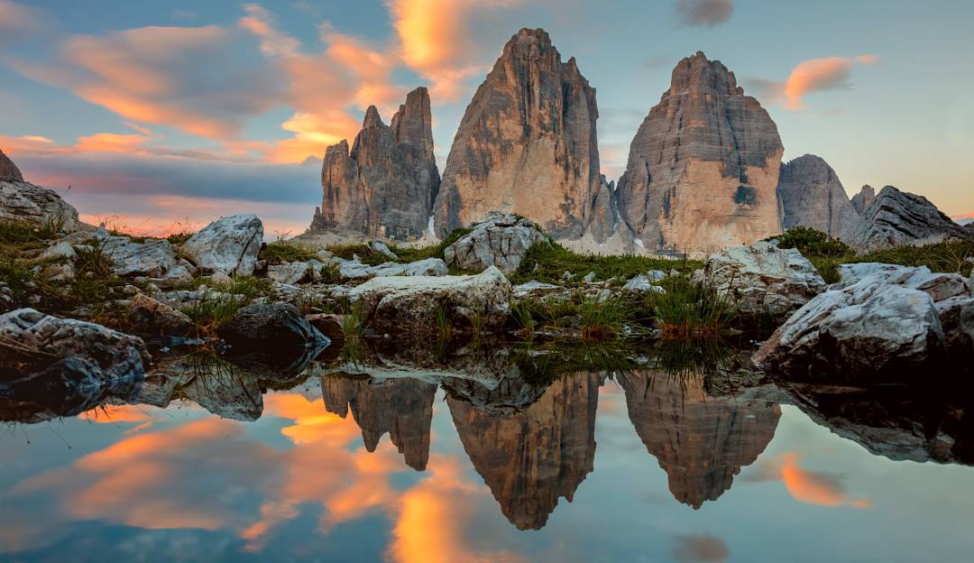Three Peaks Dolomites in Italy - the doloma mountains at sunset.