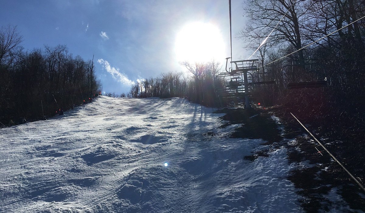 Catamount in USA - a snow covered ski slope with trees in the background.