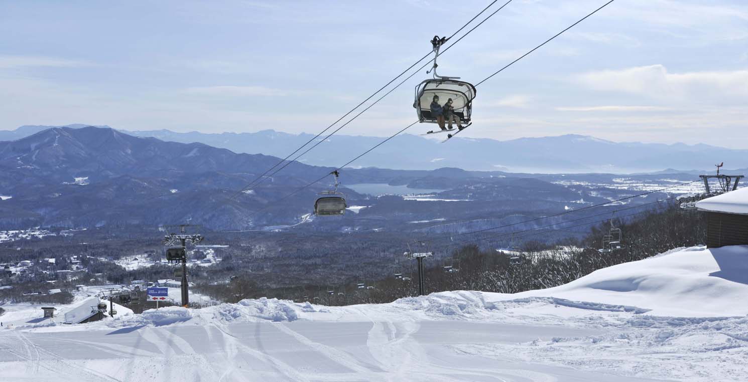 Ikenotaira Onsen in Japan - a ski lift going up the mountain.