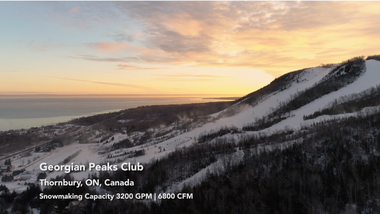 The Georgian Peaks Club in Canada - a snow covered mountain with a sunset in the background.