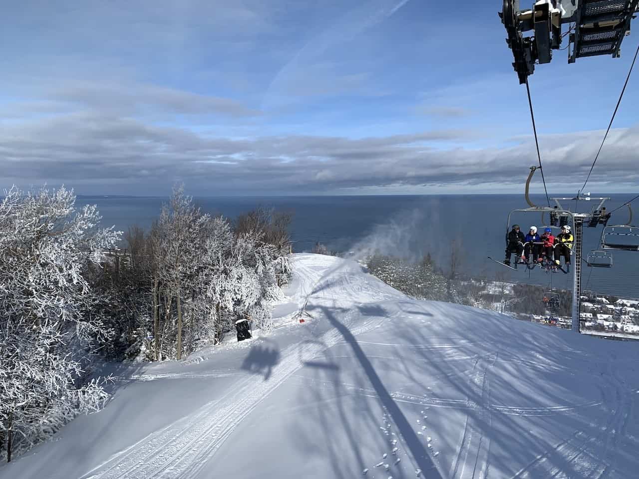 The Georgian Peaks Club in Canada - a ski lift going down a snowy slope.