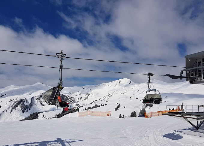 Damüls Mellau in Austria - a ski lift going up a snowy slope.
