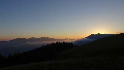 A chalet nestled in the breathtaking mountainous landscape of Doganaccia 2000 – Cutigliano in Tuscany Pistoia Italy on a sunny day.