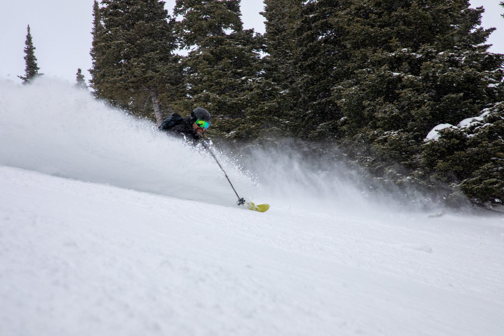 Mont Comi in Canada - a person skiing down a snow covered slope.
