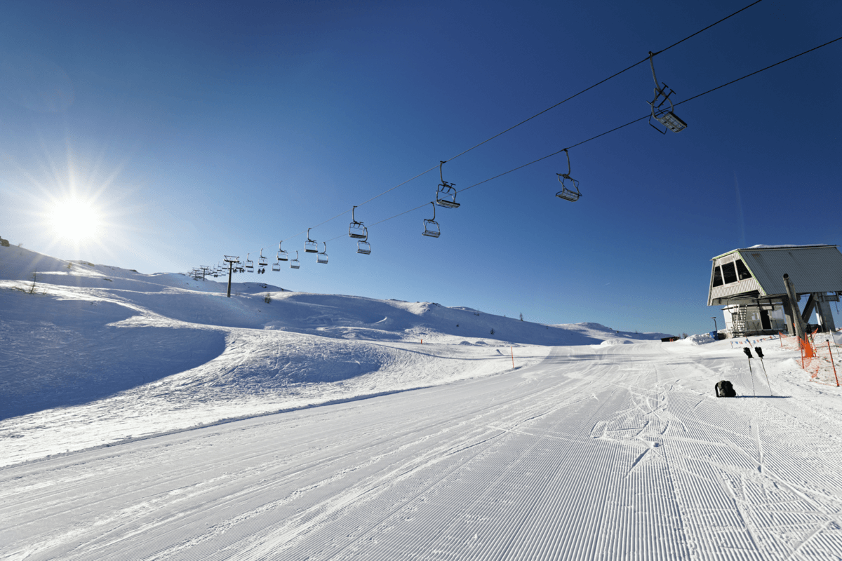 Passo Rolle in Italy - a person riding a ski board down a snowy slope.