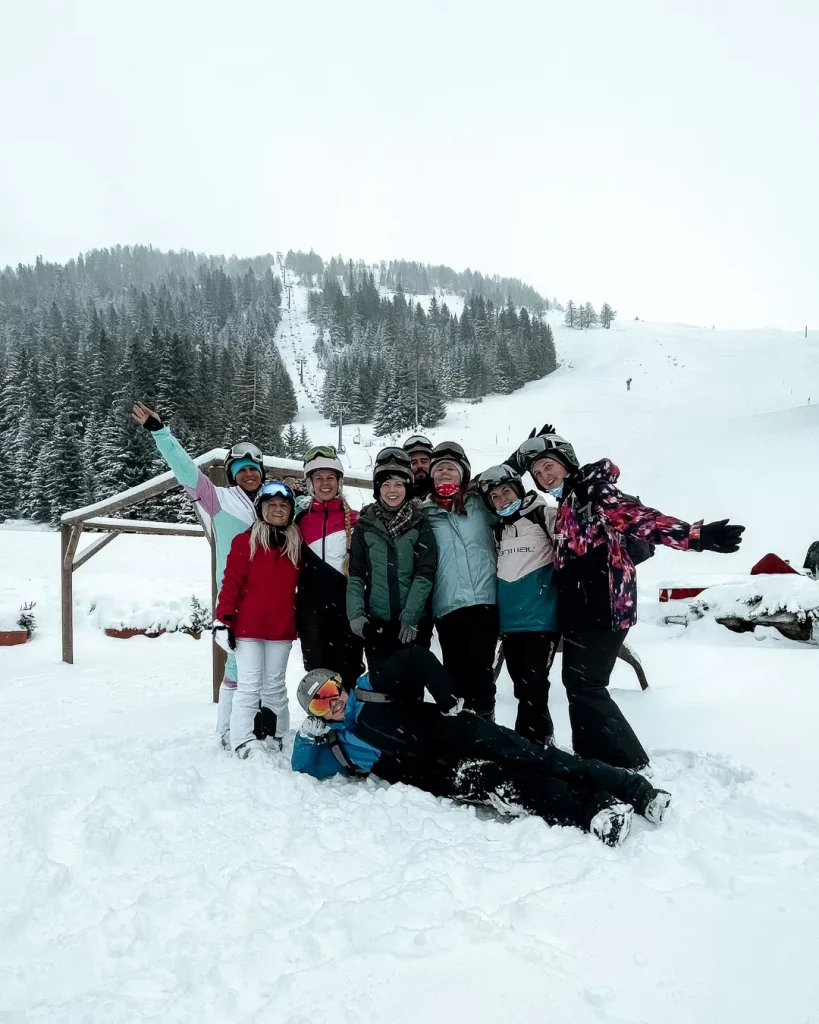 La Fouly in Switzerland - a group of people posing for a picture in the snow.