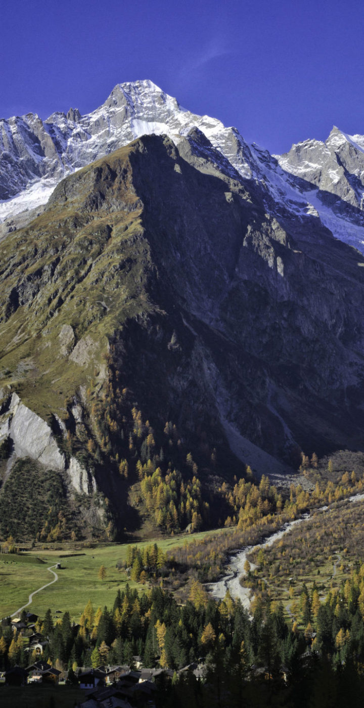 View of La Fouly in Valais Switzerland featuring a majestic mountain backdrop a quaint challet