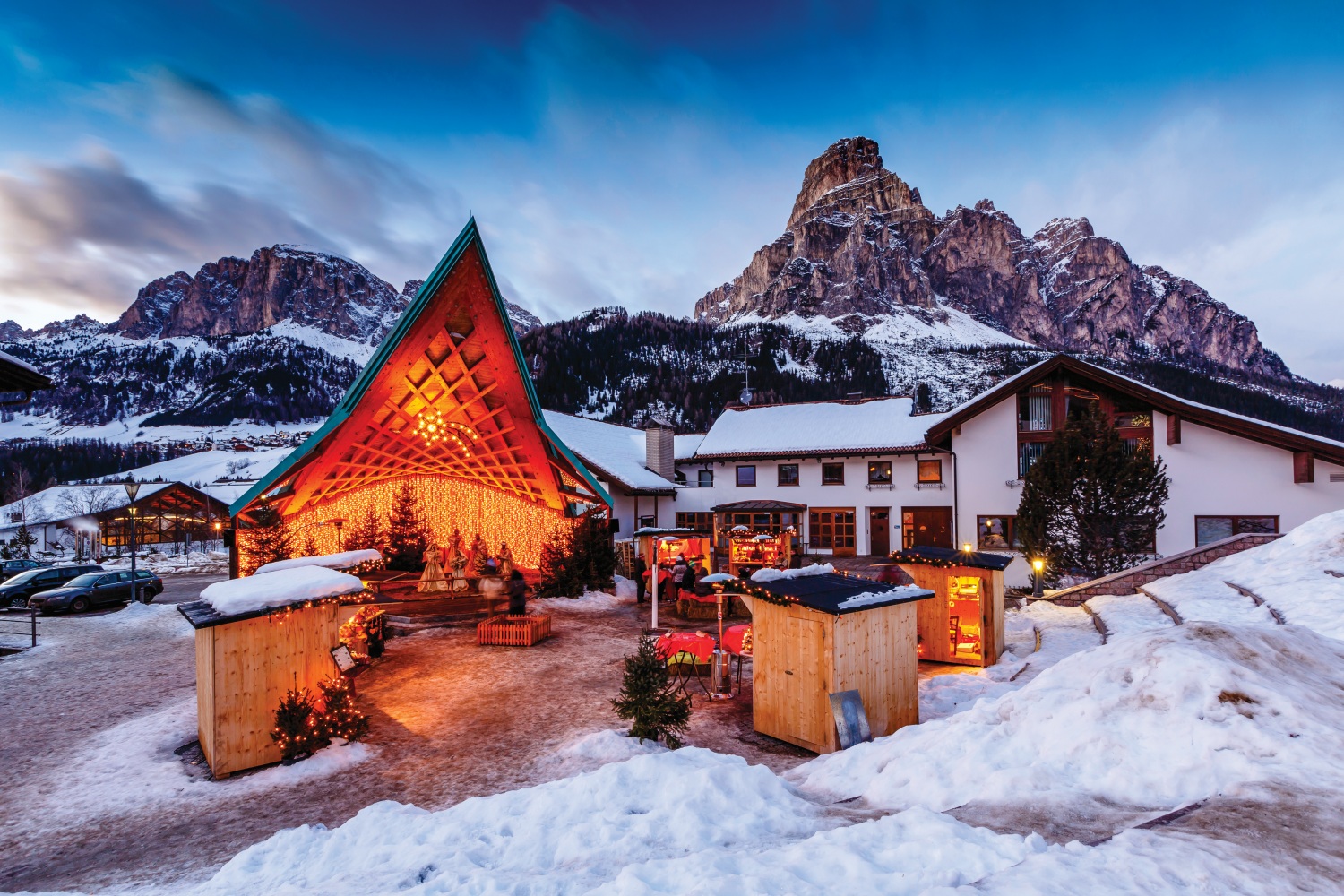 Alta Badia in Italy - a house in the mountains covered in snow.