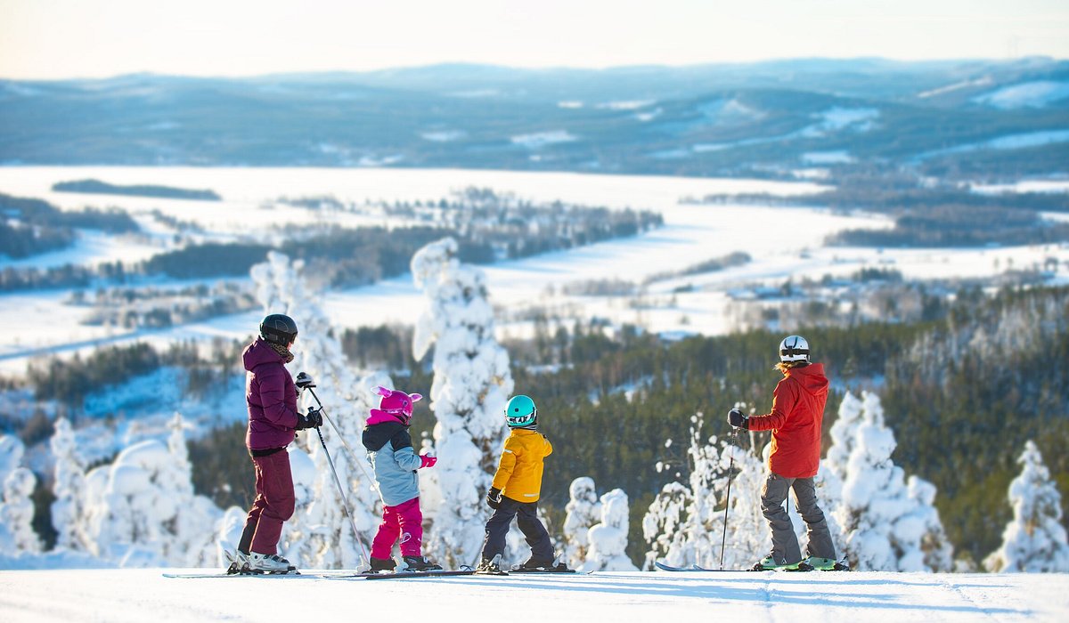 Järvsöbacken in Sweden - a group of people standing on top of a mountain.