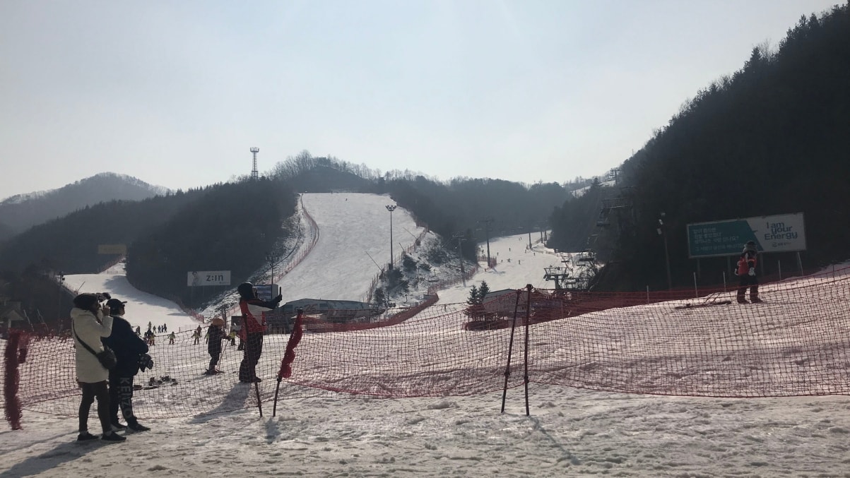 Elysian Gangchon Resort in South Korea - a group of people that are standing in the snow.