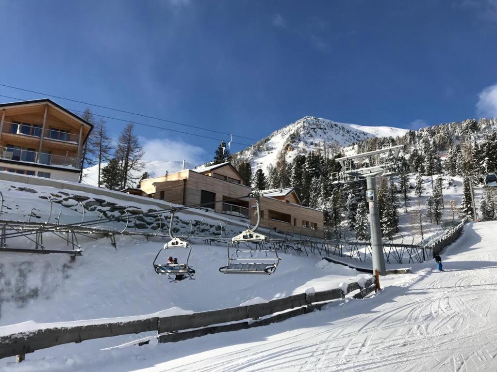 Turracher Höhe in Austria - a ski slope with a ski lift in the background.